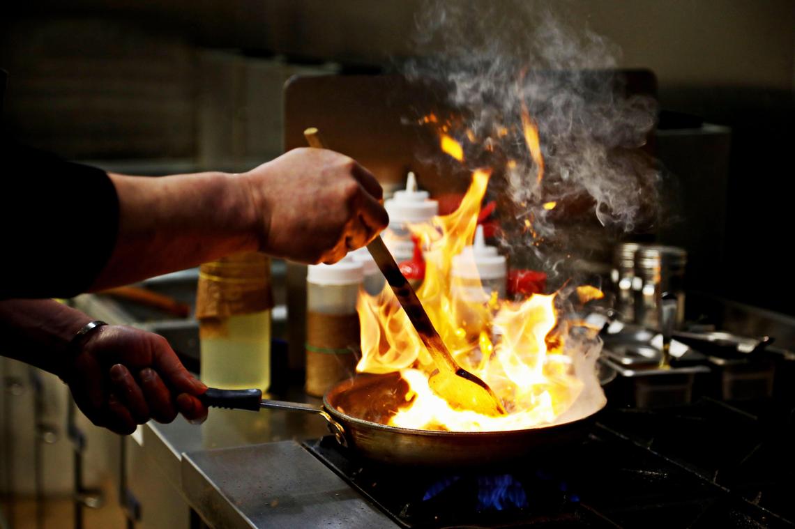Chicken Bee chef and owner Ji Hoon Kim makes bulgogi in the Durham restaurant on Wednesday, Feb. 18, 2020.