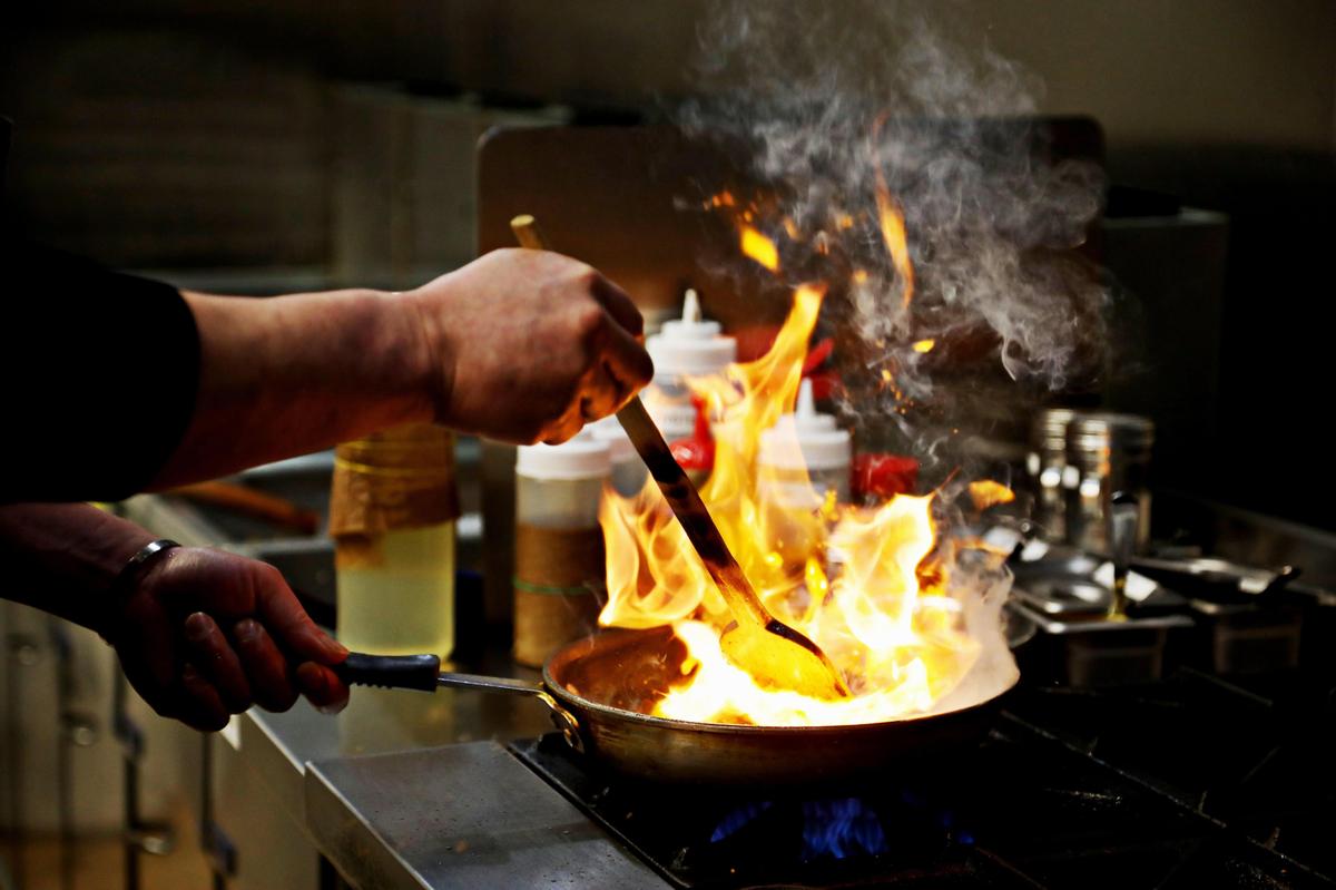 Chicken Bee chef and owner Ji Hoon Kim makes bulgogi in the Durham restaurant on Wednesday, Feb. 18, 2020.