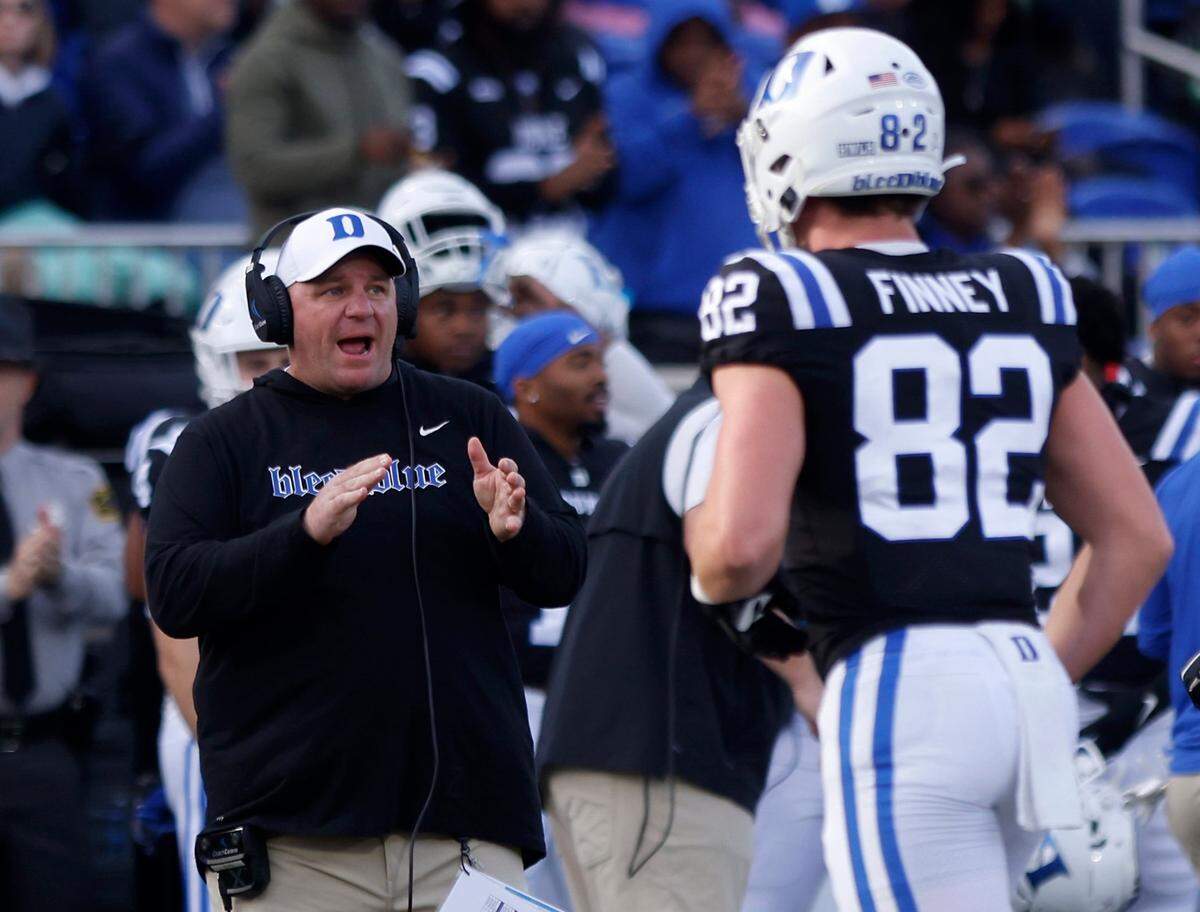 Duke head coach Mike Elko applauds his team during the Blue Devils’ final regular season game against Wake Forest on Saturday, Nov. 26, 2022, at Wallace Wade Stadium in Durham, N.C.
