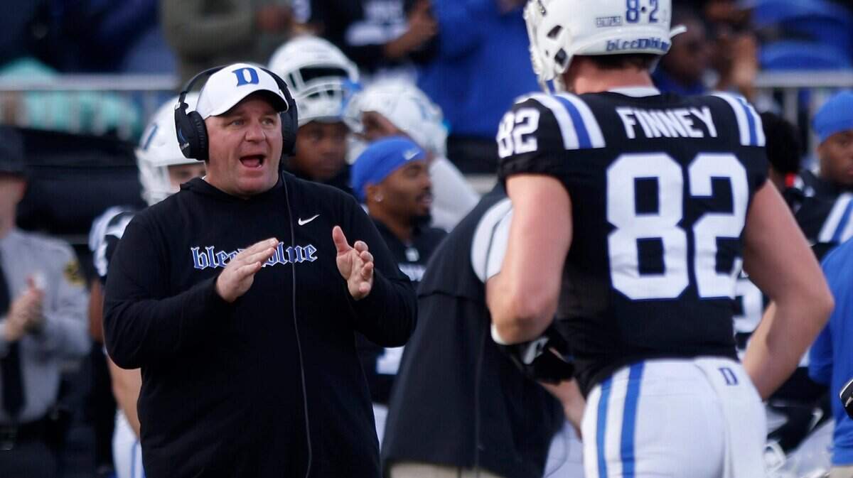 Duke head coach Mike Elko applauds his team during the Blue Devils’ final regular season game against Wake Forest on Saturday, Nov. 26, 2022, at Wallace Wade Stadium in Durham, N.C.