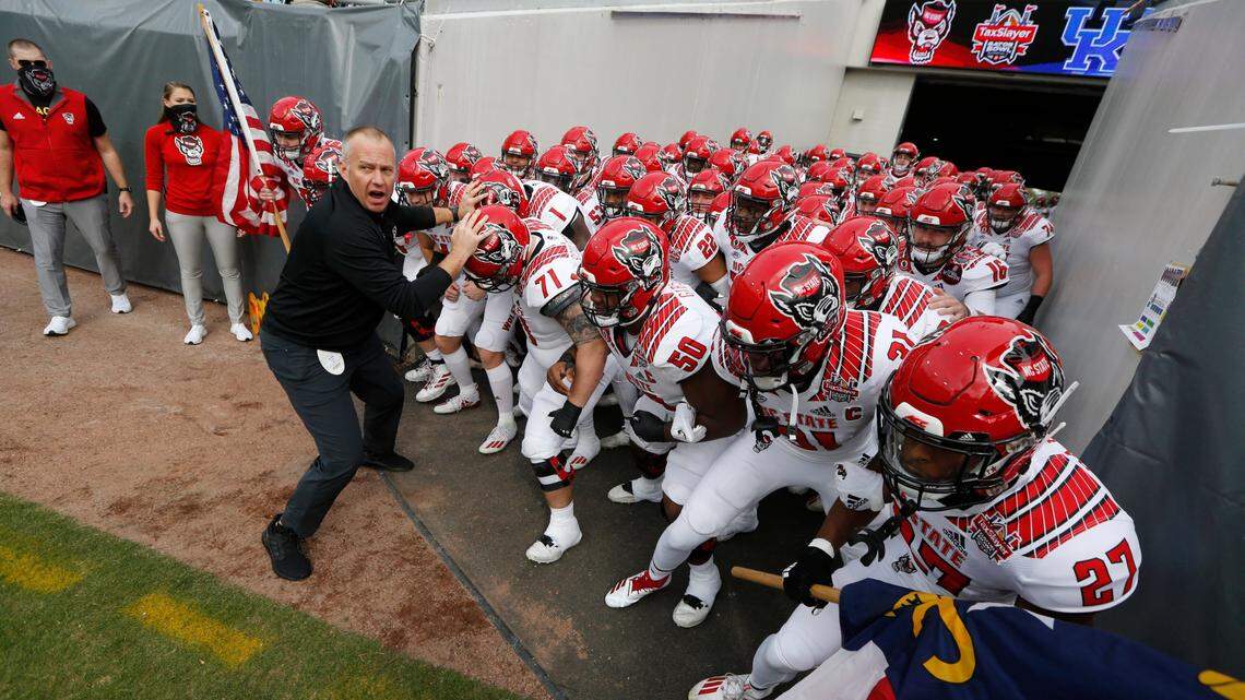 N.C. State coach Dave Doeren prepares to lead the Wolfpack onto the field before N.C. StateÕs game against Kentucky in the Gator Bowl at TIAA Bank Field in Jacksonville, Fla., Saturday, January 2, 2021.