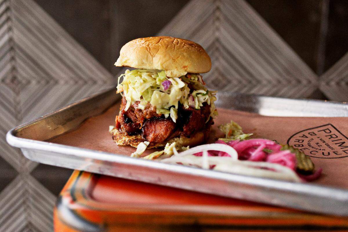 Prime Barbecue in Knightdale, NC, serves a variety of smoked meat sandwiches including the pork topped with slaw.