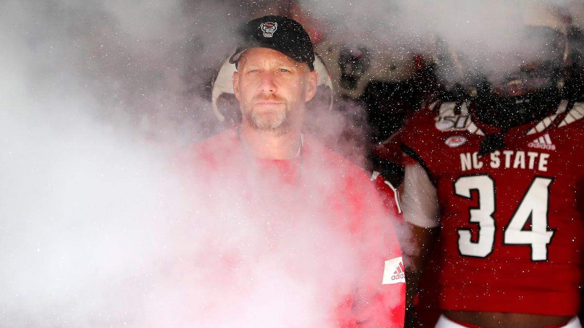 N.C. State head coach Dave Doeren prepares to head onto the field before N.C. State footballs spring game at Carter-Finley Stadium in Raleigh, N.C., Saturday, April 9, 2022.