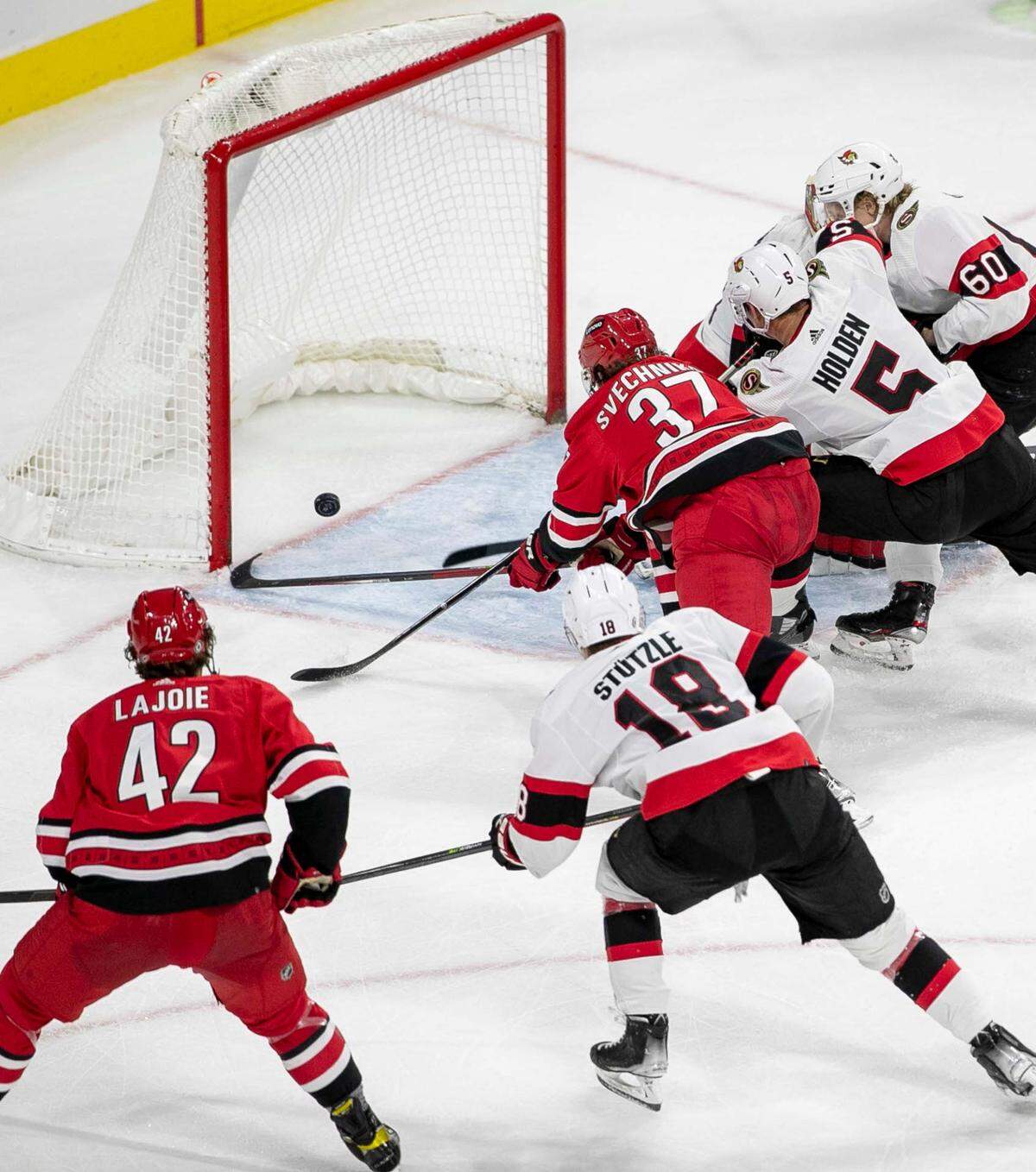 Carolina Hurricanes’ Andrei Svechnikov (37) scores on Ottawa goalie Anton Forsberg (31) during the third period to tie the Senators 2-2 on Thursday, December 2, 2021 at PNC Arena in Raleigh, N.C.