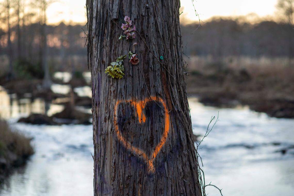 A heart is painted on a tree at Hayes Pond south of downtown Maxton, N.C. on Tuesday, November 30, 2021. Hayes Pond was the site of an historic event when the Lumbee Tribe and other Native Americans ousted the Ku Klux Klan from Maxton in January 1958