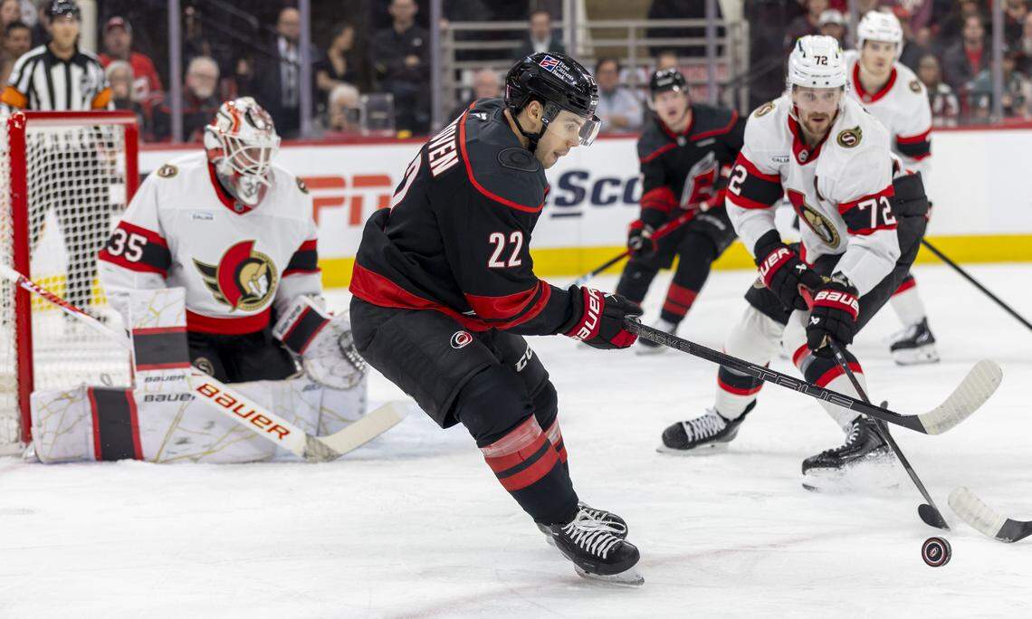 Carolina Hurricanes center Logan Stankoven (22) works to control the puck against Ottawa defenseman Thomas Cabot (72)  in the first period of Game 2 on Monday, April 20, 2026 during the first round of the Stanley Cup Playoffs at Lenovo Center in Raleigh, N.C. 