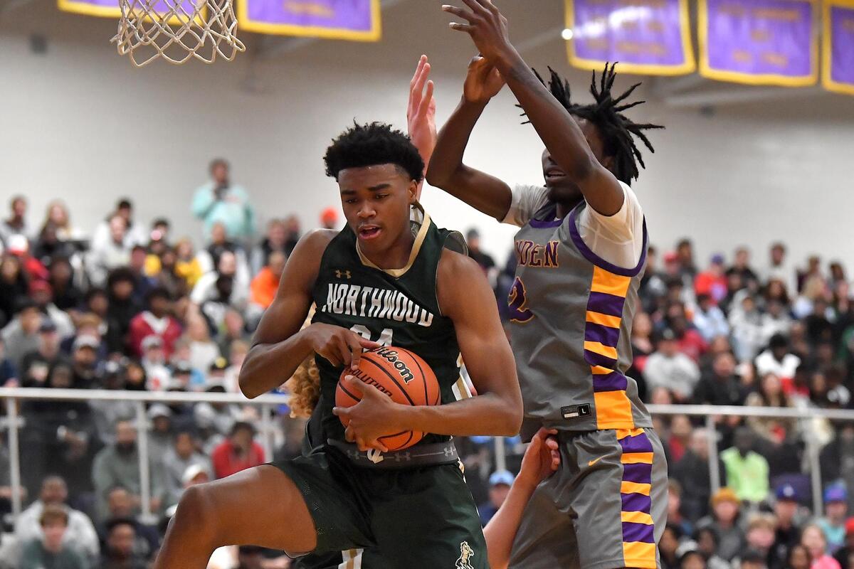 Northwood’s Max Frazier (34) controls the rebound against Camden’s Aaron Bradshaw (2) during the first half. The Camden (NJ) Panthers and the Northwood Chargers met in the John Wall Holiday Invitational in Raleigh, N.C. on December 28,2022 .