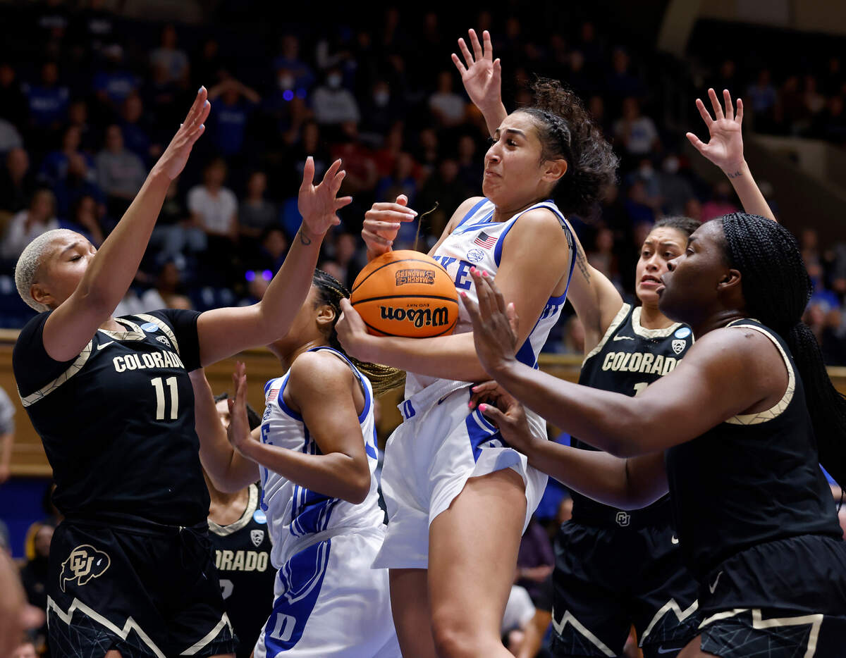 Duke’s Taya Corosdale, center, pulls down a rebound during the first half of the Blue Devils’ NCAA Tournament second round game against Colorado at Cameron Indoor Stadium on Monday, March 20, 2023, in Durham, N.C.