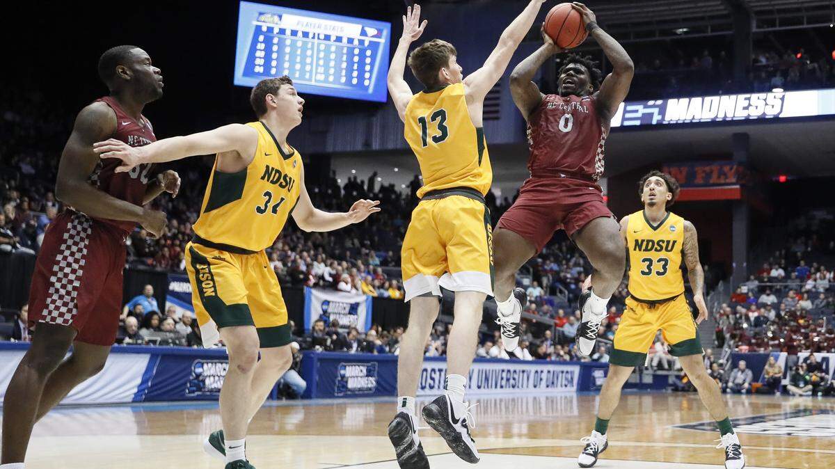 North Carolina Central’s Larry McKnight Jr. (0) shoots against North Dakota State’s Chris Quayle (13) during the first half of a First Four game of the NCAA men’s college basketball tournament Wednesday, March 20, 2019, in Dayton, Ohio. 