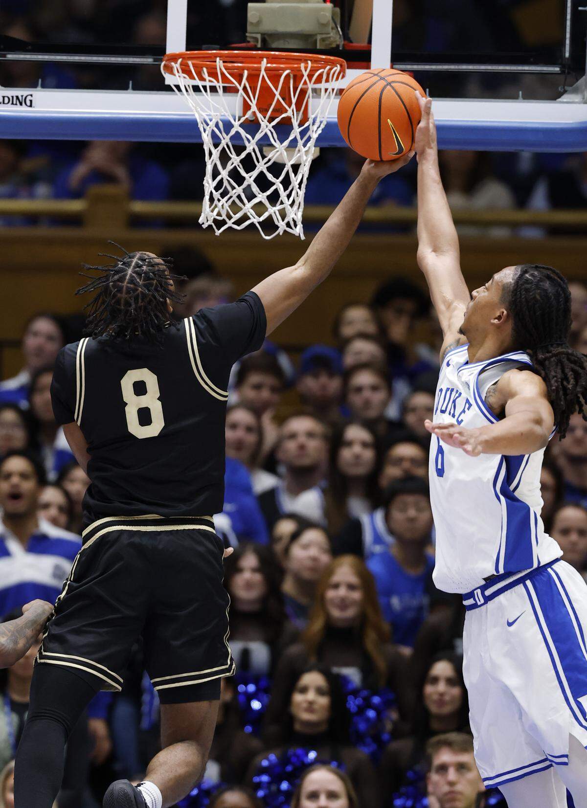Duke’s Maliq Brown (6) blocks the shot by Wake Forest's Mekhi Mason (8) during the second half of Duke’s 90-69 victory over Wake Forest at Cameron Indoor Stadium in Durham, N.C., Saturday, Jan. 24, 2026.