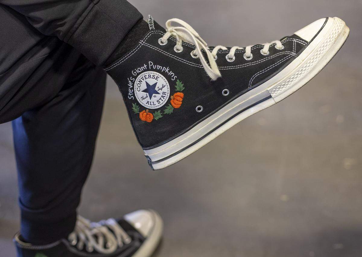Steven Hall of Covington, VA, sports a pair of custom pumpkin sneakers.  Hall’s giant pumpkin entry weighed 1,511.1 pounds.  
