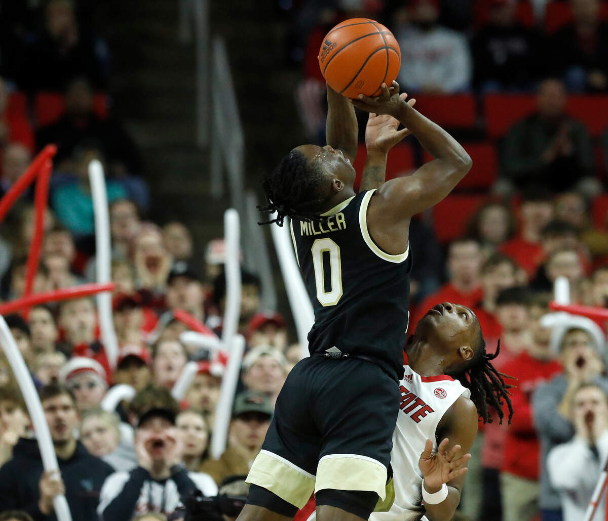 N.C. State’s DJ Horne fouls Wake Forest’s Kevin Miller during the first half of the Wolfpack’s 83-76 win at PNC Arena on Tuesday, Jan. 16, 2024, in Raleigh, N.C.