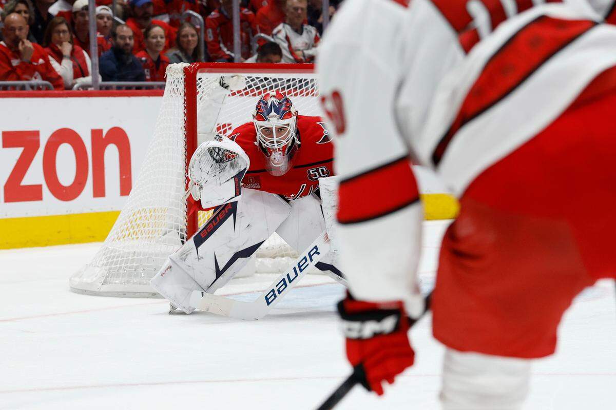 May 8, 2025; Washington, District of Columbia, USA;Washington Capitals goaltender Logan Thompson (48) prepares to make a save on Carolina Hurricanes left wing Eric Robinson (50) in the second period in game two of the second round of the 2025 Stanley Cup Playoffs at Capital One Arena. Mandatory Credit: Geoff Burke-Imagn Images