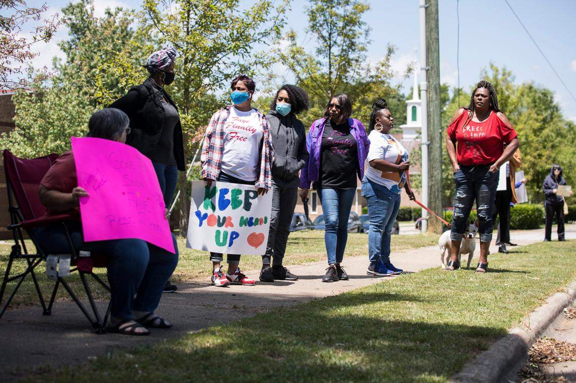 A small group of former inmates and supporters from the N.C. Correctional Institution for Women gathered across the street from the facility to protest prison conditions on Saturday, May 9, 2020. Their friend, 67-year-old Faye Brown, died there Wednesday, May 6 of COVID-19 complications. They have argued for early release of nonviolent offenders and those within two years of finishing their sentences to prevent the spread of the virus, citing personal knowledge of the conditions that make social distancing impossible.