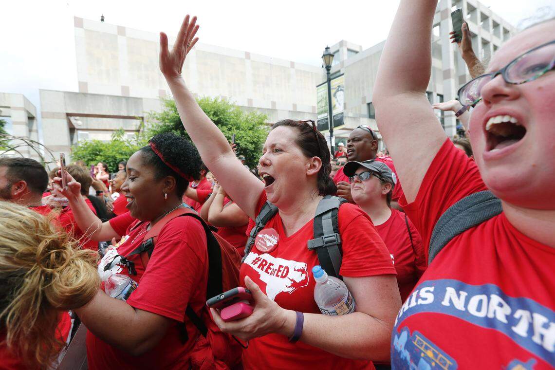 From left, Melodie Bryant of Shallotte, Carol Cosetti of Clayton and Sandra Thornton of Willow Spring cheer on the speakers during the Rally for Respect at Bicentennial Plaza in Raleigh on Wednesday.