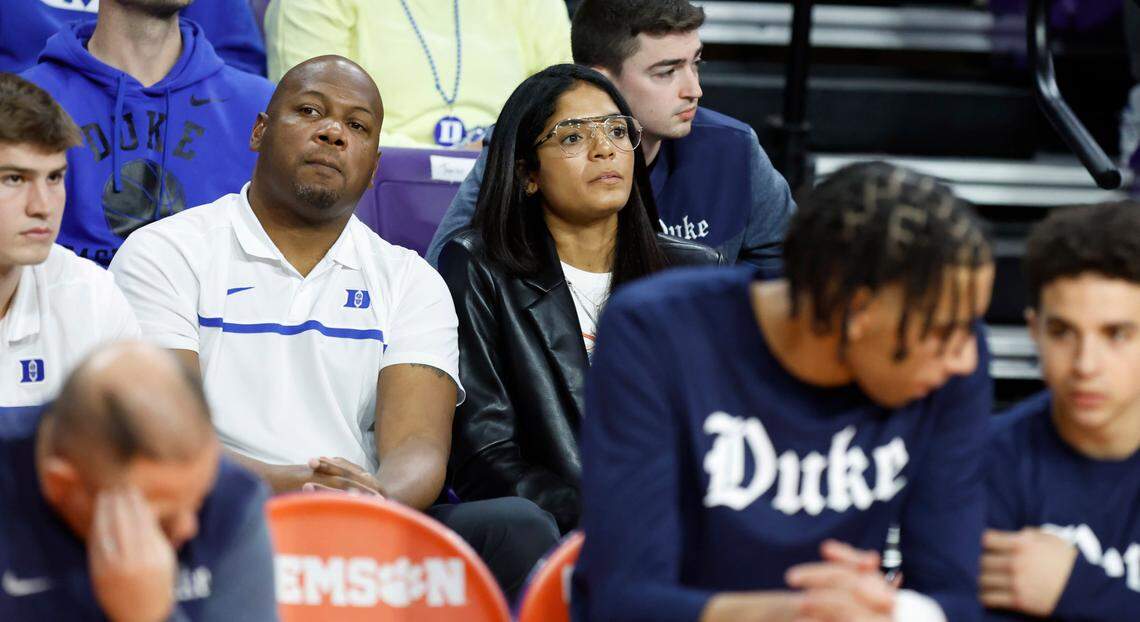 Duke basketball general manager Rachel Baker, center right, and Will Avery watch during the Blue Devils’ game against Clemson at Littlejohn Coliseum in Clemson, S.C., Saturday, Jan. 14, 2023.
