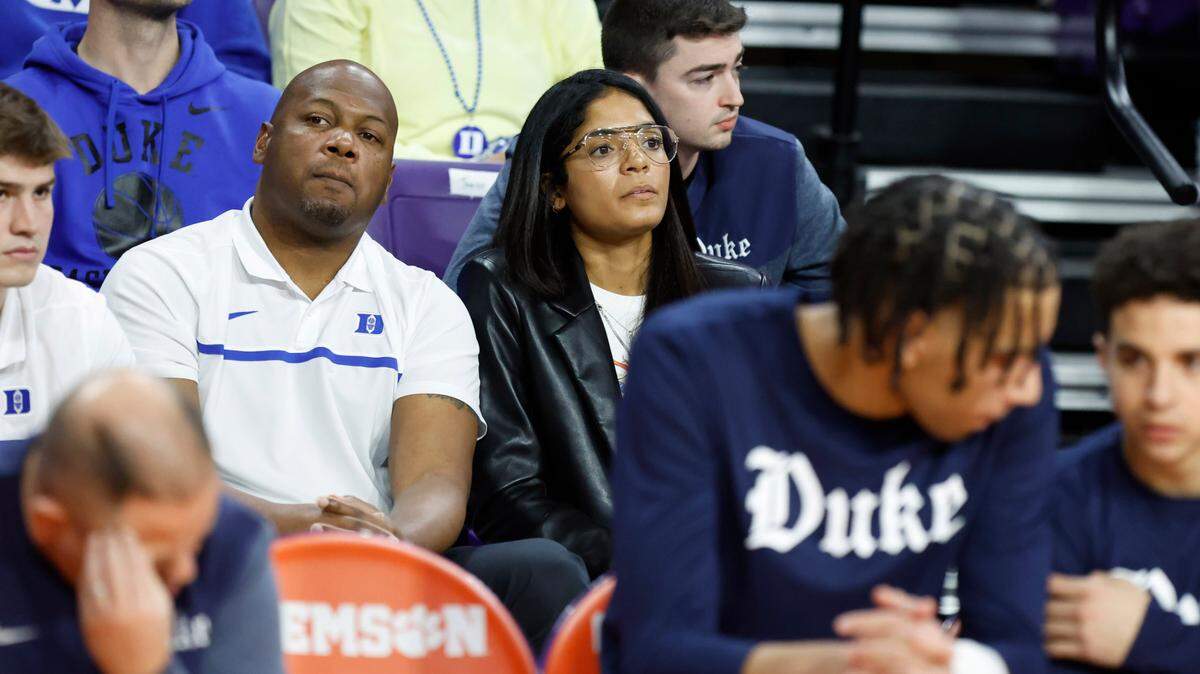 Duke basketball general manager Rachel Baker, center right, and Will Avery watch during the Blue Devils’ game against Clemson at Littlejohn Coliseum in Clemson, S.C., Saturday, Jan. 14, 2023.