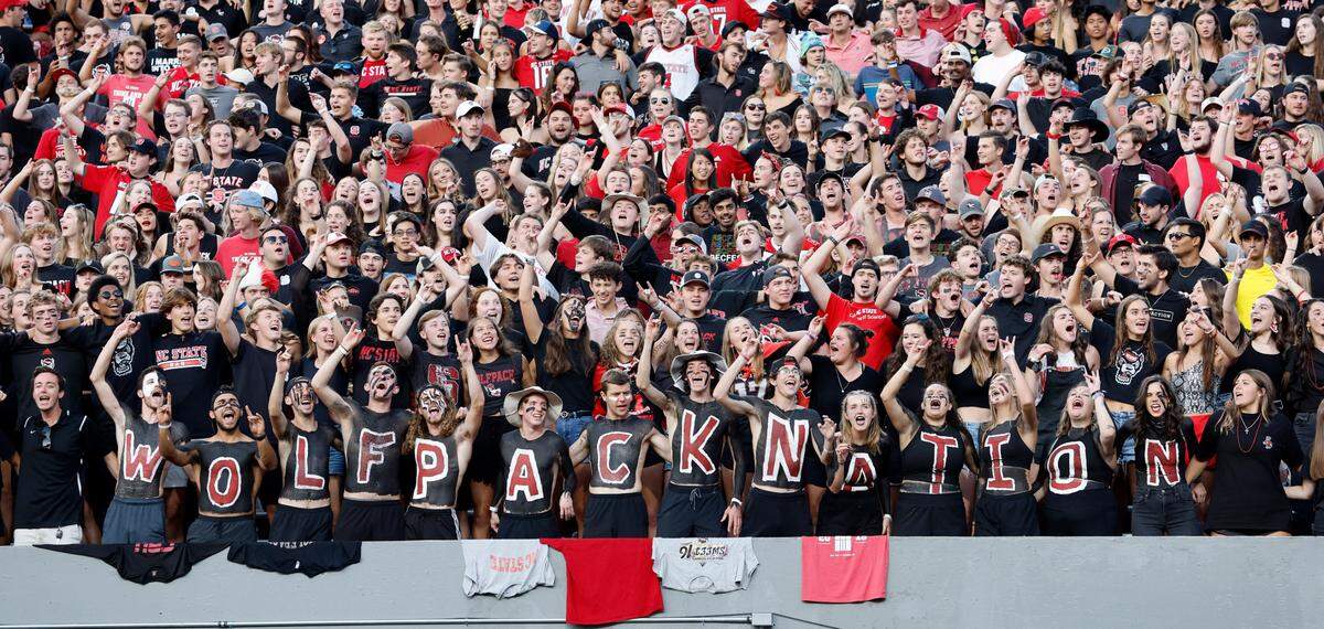 Fans sing the alma mater before N.C. State’s game against Texas Tech at Carter-Finley Stadium in Raleigh, N.C., Saturday, Sept. 17, 2022.