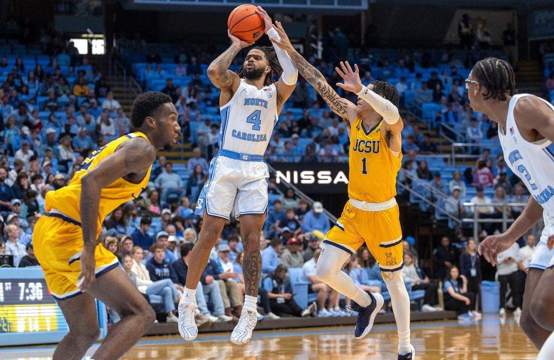 North Carolina guard R.J. Davis (4) puts up a three-point shot against Johnson C. Smith’s Anthony Williams (1) during the first half on Sunday, October 27, 2024 at the Smith Center in Chapel Hill, N.C.