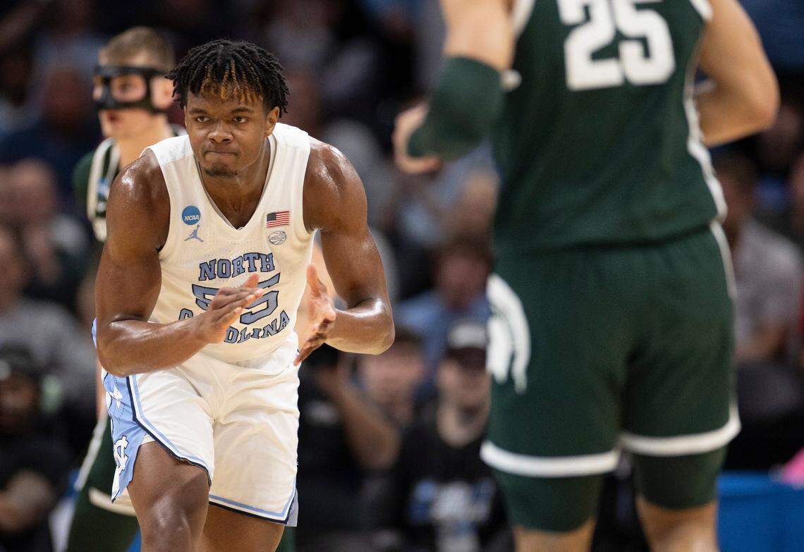 North Carolina’s Harrison Ingram (55) reacts after cutting the Michigan State lead to one point during the first half on Saturday, March 23, 2024, during the second round of the NCAA Tournament at Spectrum Center in Charlotte, N.C.