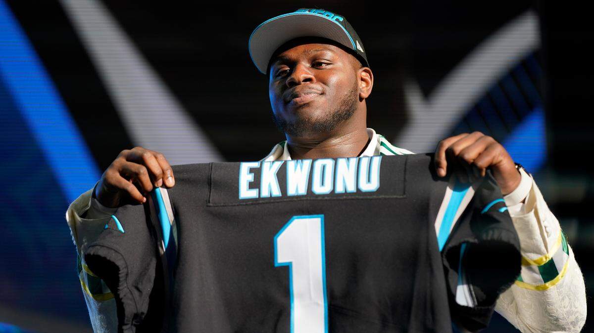 North Carolina State offensive tackle Ikem Ekwonu poses for photos after being picked by the Carolina Panthers with the sixth pick of the NFL football draft Thursday, April 28, 2022, in Las Vegas.