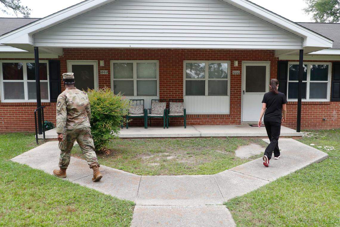 Erin Smith, family nurse practitioner with the Johnston County Public Health Department, and Spc. Stephon Williams with the North Carolina Army National Guard go door to door in the Smithfield Housing Authoritys subdivision of Woodall Heights during a pop up vaccine clinic in Smithfield, N.C. Tuesday, June 8, 2021. Smith and Spc. Williams were asking those at home if they wanted to get a COVID-19 vaccine shot.
