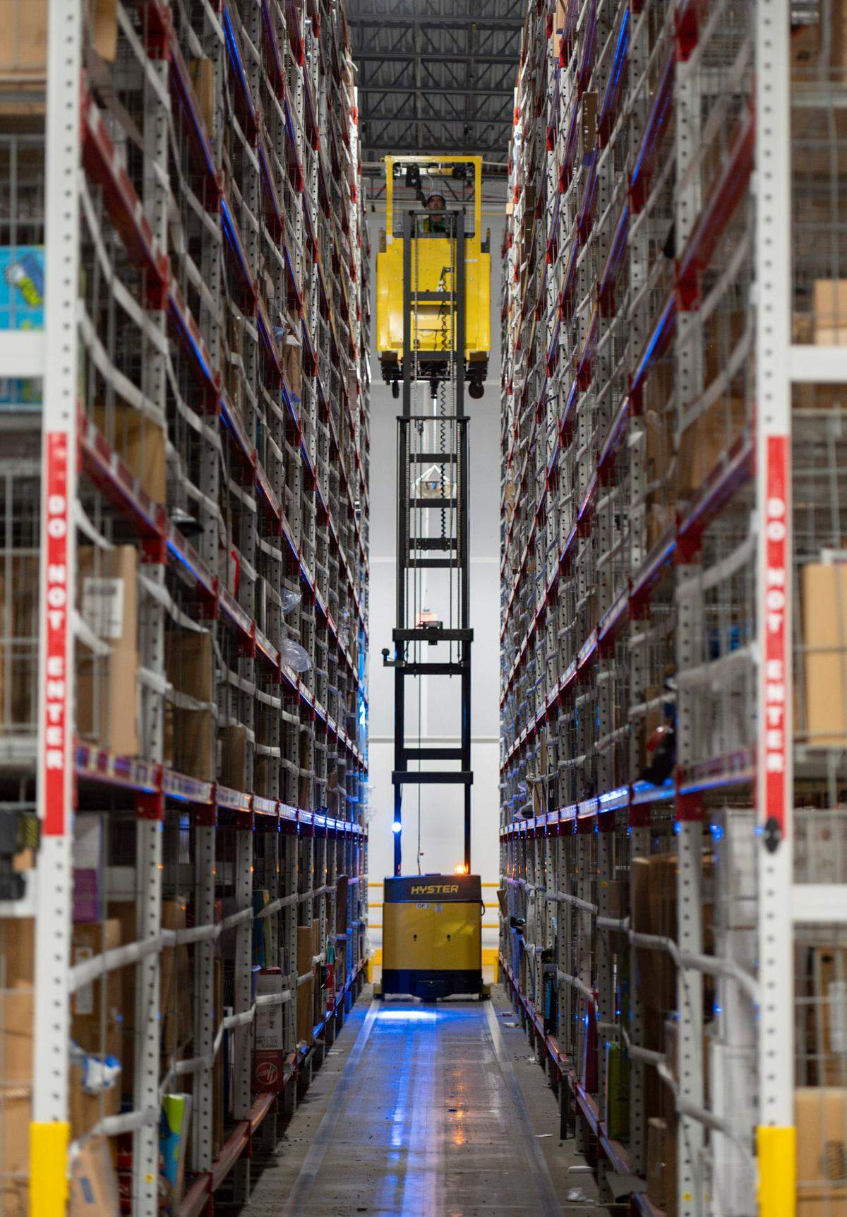 An Amazon worker uses a lift to collect larger items to ship at the Same-Day Delivery Fulfillment Center in Durham on Wednesday July 10, 2024.