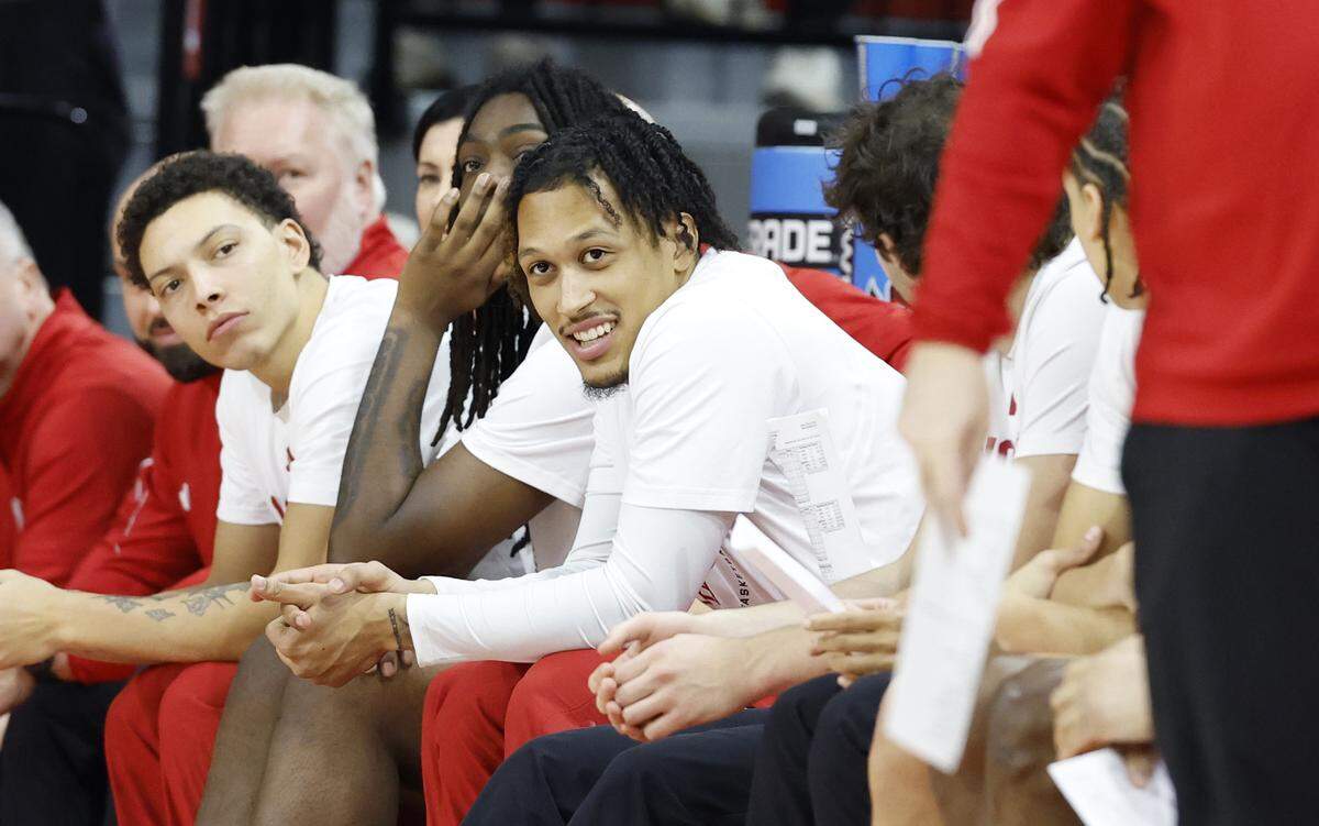 N.C. State's Darrion Williams, center, watches from the bench during the first half of N.C. State’s game against Texas Southern at Reynolds Coliseum in Raleigh, North Carolina, on Wednesday, Dec. 17, 2025.