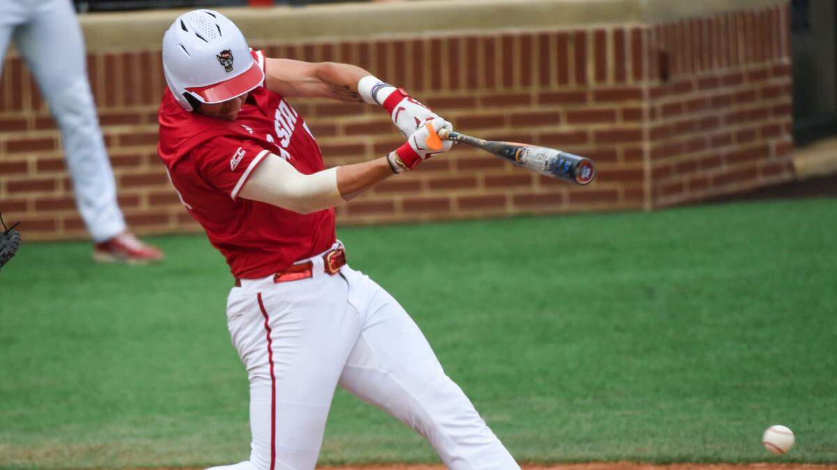 NC State Wolfpack’s Brandon Novy (50) connects with the ball against the Stetson Hatters during the NCAA Baseball Regional Tournament at Plainsman Park in Auburn, Ala., on Friday, May 30, 2025. In a Sunday elimination game, Novy helped key an offensive outburst to keep N.C. State’s NCAA Tournament hopes alive.