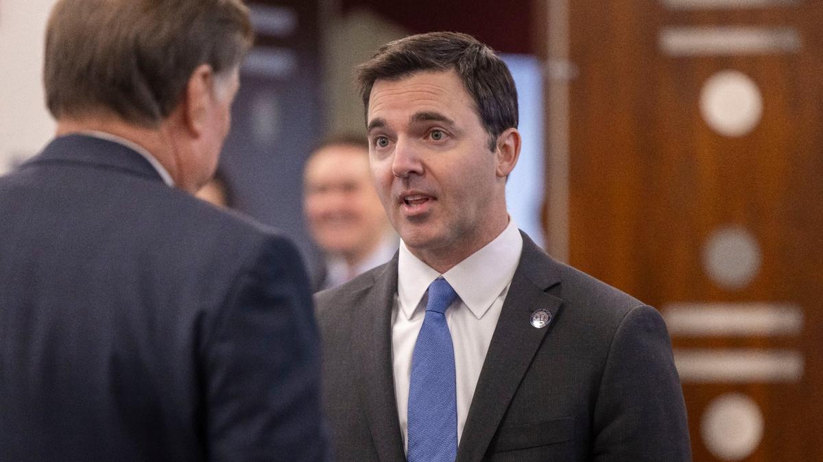 North Carolina Attorney General Jeff Jackson talks with Commissioner of Insurance Mike Causey, prior to the Council of State meeting on Tuesday, February, 4, 2025 in Raleigh, N.C.