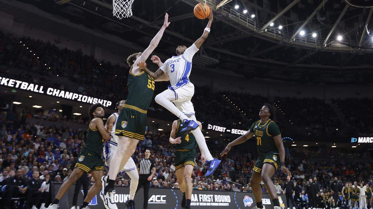 Duke’s Isaiah Evans (3) goes up to slam in two during Duke’s 71-65 victory over Siena in the first round of the NCAA Men’s Basketball Tournament at Bon Secours Wellness Arena in Greenville, S.C., Thursday, March 19, 2026.