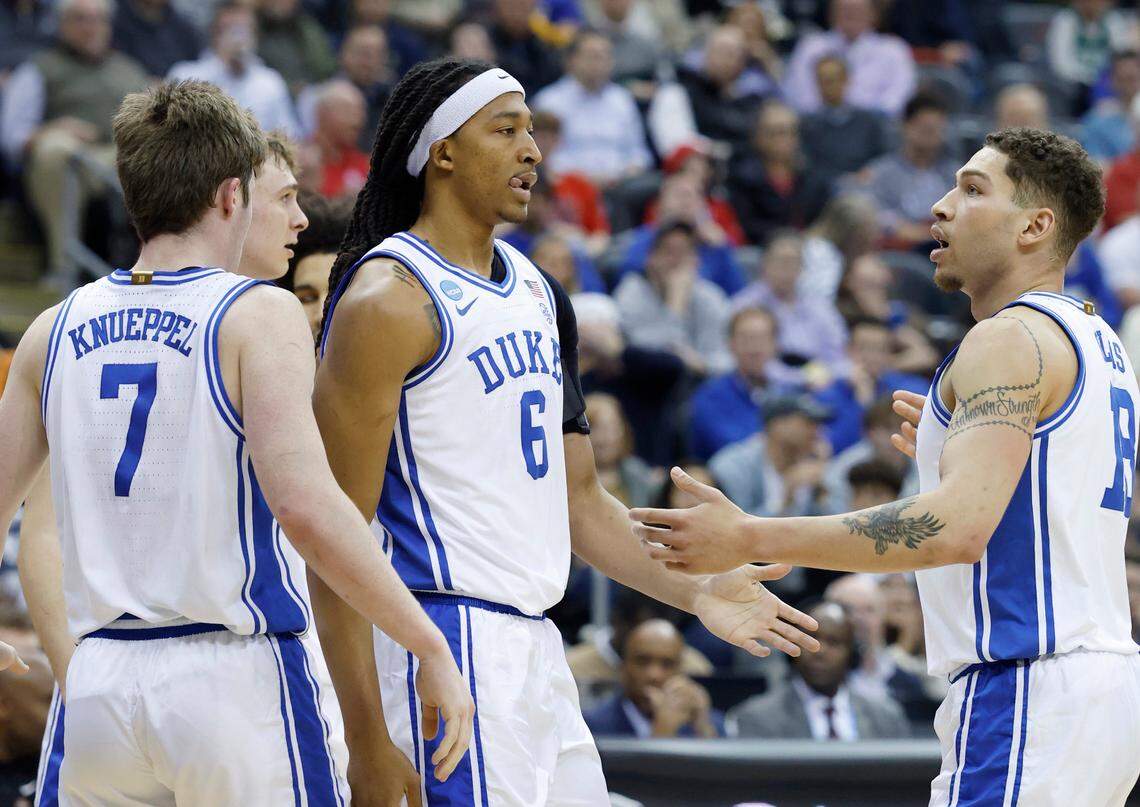 Duke’s Mason Gillis (18) talks with Maliq Brown (6) during the first half of Duke’s game against Arizona in the Sweet 16 round of the 2025 Men’s NCAA Basketball Championship at the Prudential Center in Newark, N.J., Thursday, March 27, 2025.