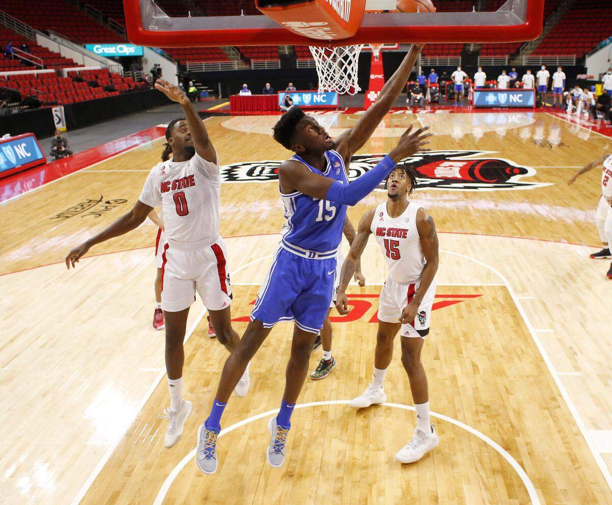Duke’s Mark Williams (15) puts in a shot during Duke’s 69-53 victory over N.C. State at PNC Arena in Raleigh, N.C., Saturday, February 13, 2021.