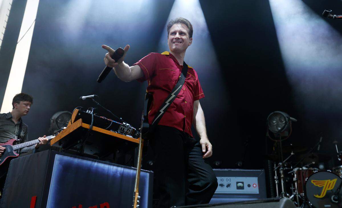 Singer Alexander Kapranosas acknowledges the crowd as Franz Ferdinand opens for the Pixies during a concert at Red Hat Amphitheater in Raleigh, N.C., Friday, June 16, 2023.