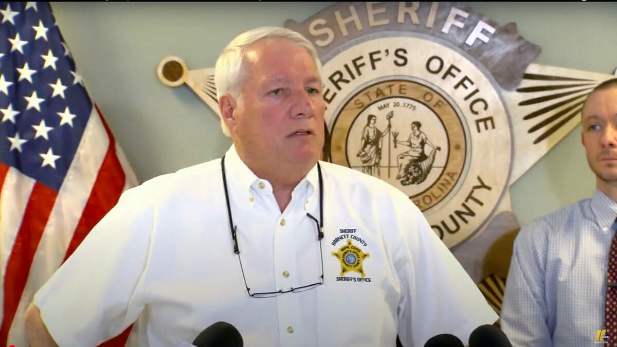 Harnett County Sheriff Wayne Coats speaks at a press conference after two men were arrested in the abduction of a girl after connecting with her online.