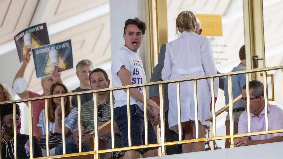 A demonstrator yells, “Protect trans kids.” following veto override votes in the House at the General Assembly in Raleigh on Wednesday, Aug 16, 2023.