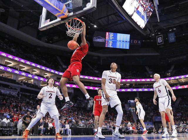N.C. State's Ven-Allen Lubin slams in two during the first half of the Wolfpack’s ACC Tournament quarterfinal game against Virginia on Thursday, March 12, 2026, at the Spectrum Center in Charlotte, N.C. 