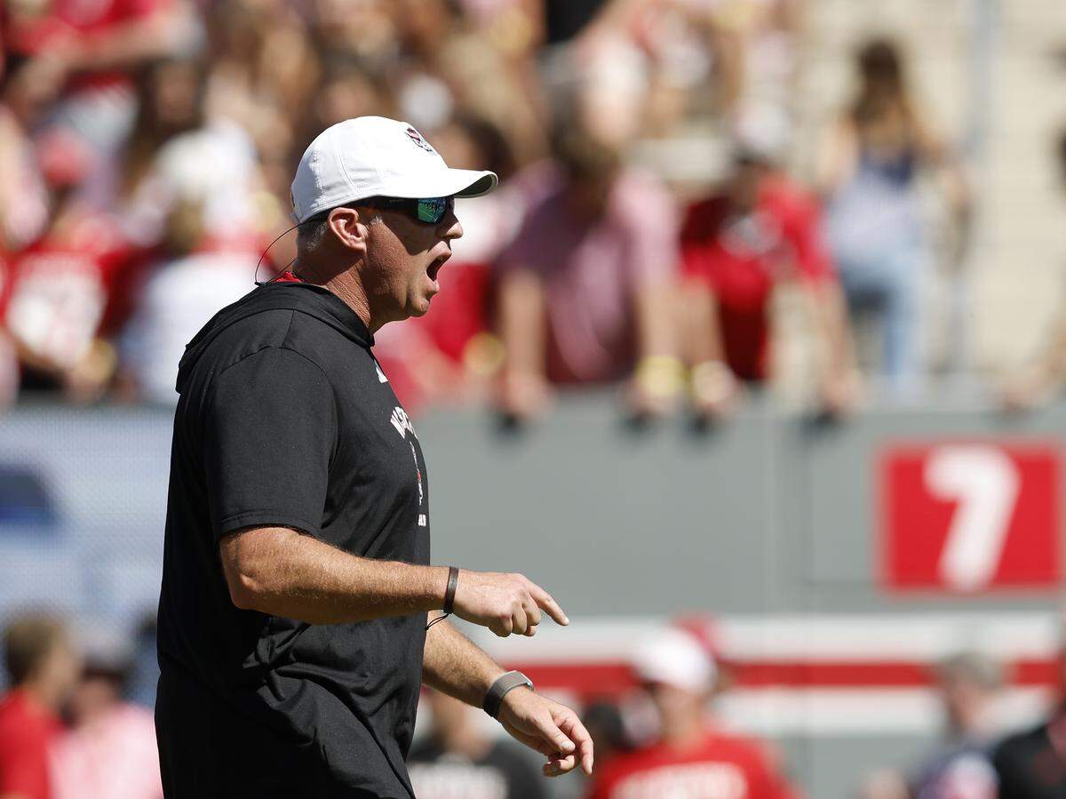 N.C. State head coach Dave Doeren gives instructions to his players prior to the Wolfpack’s game against Campbell on Saturday, Oct. 4, 2025, at Carter-Finley Stadium in Raleigh, N.C.