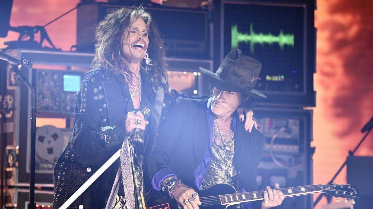 Jan 26, 2020; Los Angeles, CA, USA;  Steven Tyler (left) and Joe Perry of Aerosmith performs during the 62nd annual GRAMMY Awards on Jan. 26, 2020 at the STAPLES Center in Los Angeles, Calif. Mandatory Credit: Robert Hanashiro-USA TODAY
