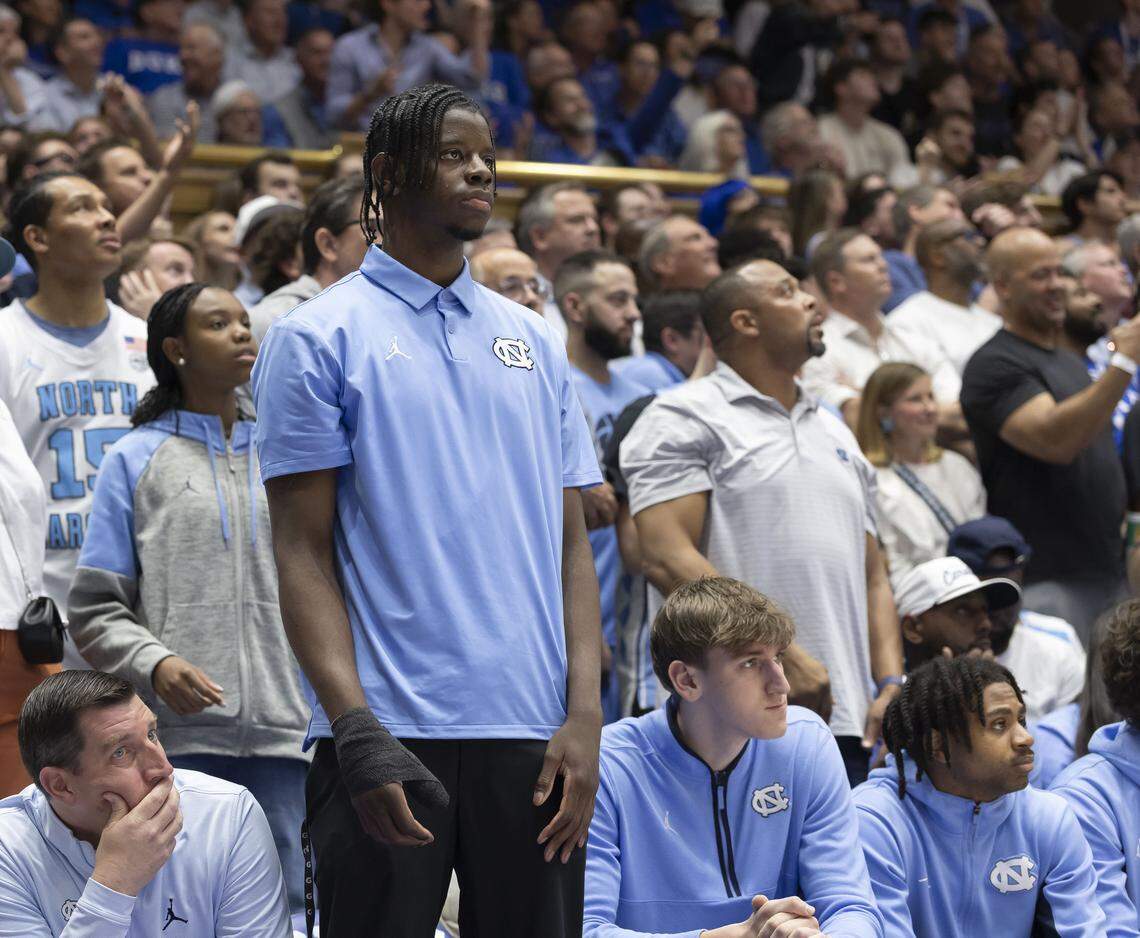 North Carolina forward Caleb Wilson (8), out with a broken thumb, watches the first half against Duke on Saturday, March 7, 2026 at Cameron Indoor Stadium in Durham, N.C.