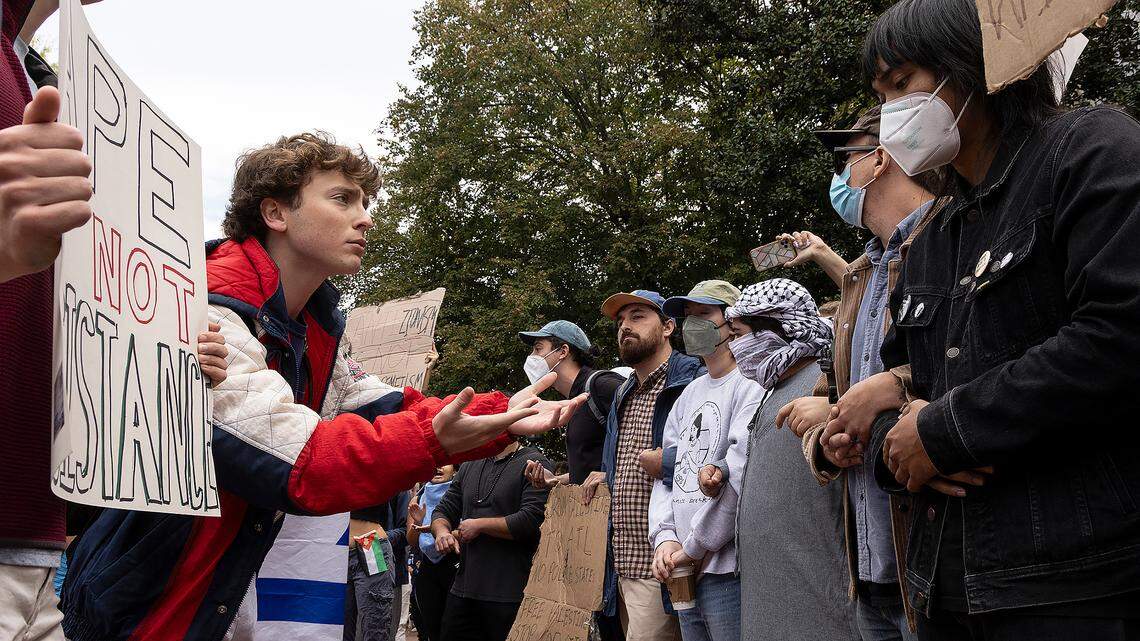 Counter-protesters and Pro-Palestine demonstrators interact during a rally in support of Palestinians at UNC-Chapel Hill on Thursday, Oct. 12, 2023. The rally was organized by the UNC chapter of Students for Justice in Palestine.