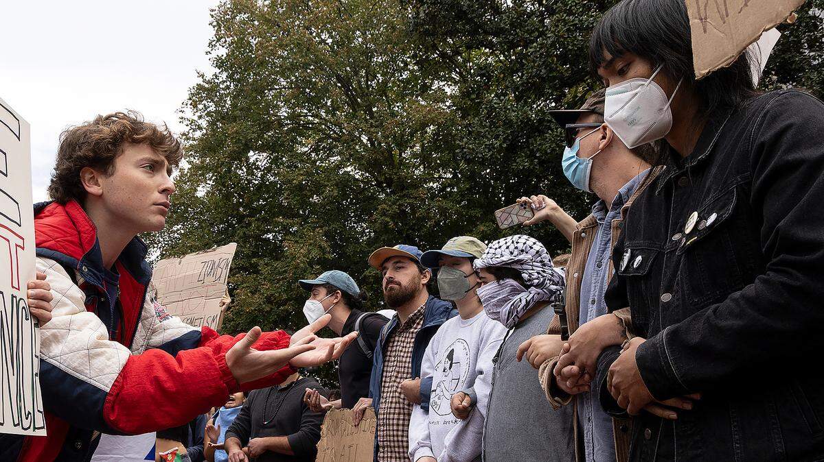 Counter-protesters and Pro-Palestine demonstrators interact during a rally in support of Palestinians at UNC-Chapel Hill on Thursday, Oct. 12, 2023.