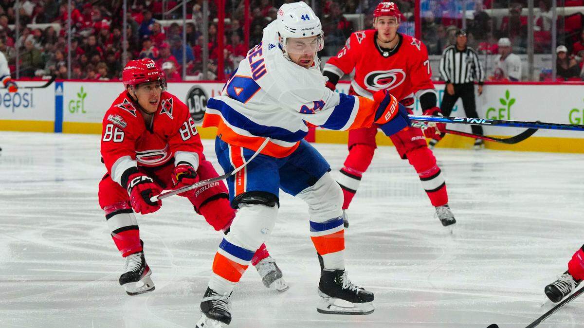 New York Islanders center Jean-Gabriel Pageau (44) takes a shot against Carolina Hurricanes left wing Teuvo Teravainen (86) during the second period in game two of the first round of the 2023 Stanley Cup Playoffs at PNC Arena.