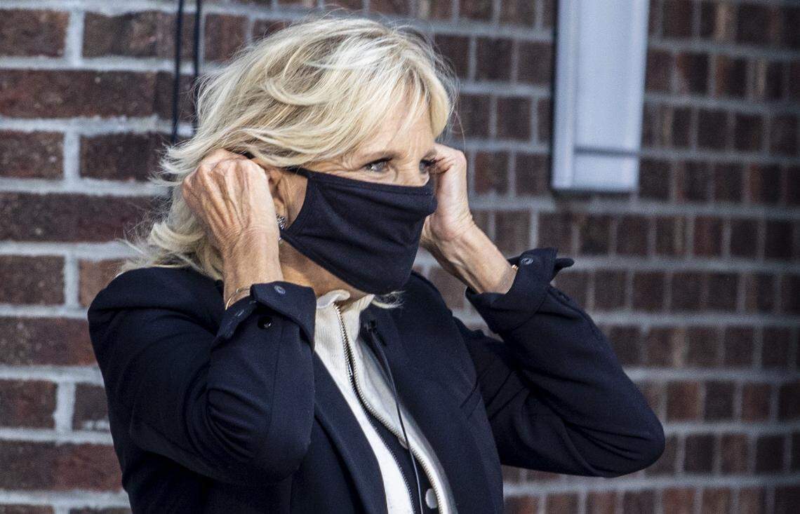 Jill Biden puts on a mask her after campaigning for her husband and former Vice President Joe Biden before a small crowd outside the Rudolph Jones Student Center at Fayetteville State University in Fayetteville, NC during a Get Out the Vote rally on Tuesday, Oct. 6, 2020.