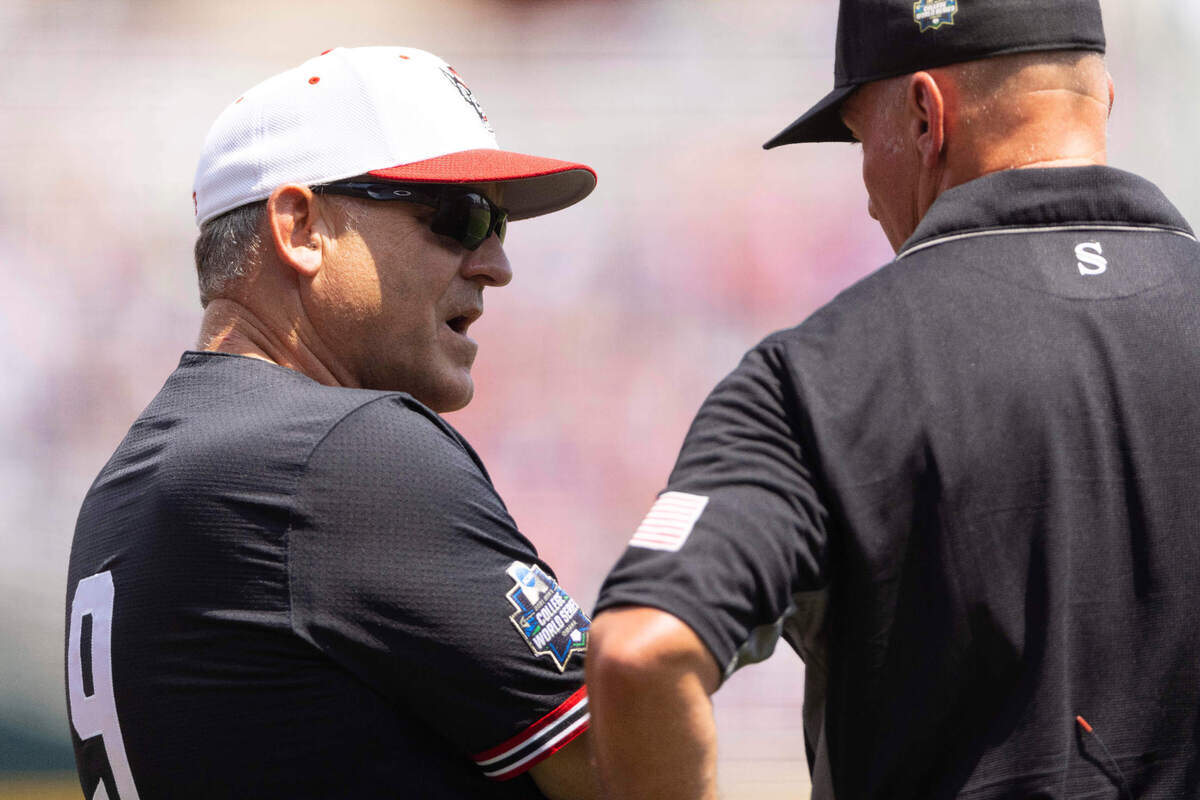North Carolina State head coach Elliott Avent, left, argues a hit by Vojtech Mensik was fair in the second inning against Vanderbilt during a baseball game in the College World Series, Friday, June 25, 2021, at TD Ameritrade Park in Omaha.