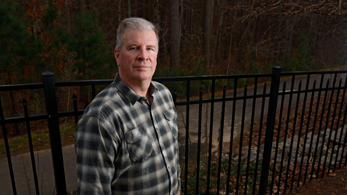Eddie Hunnell is photographed at his home in Holly Springs, N.C. on Friday, Dec. 13, 2024. Hunnell, who was in Grassy Creek for his son’s wedding rehearsal dinner on Sept. 27, jumped in the flooded waters of the North Fork of the New River to save Leslie Worth, 62, after her home washed downstream.
