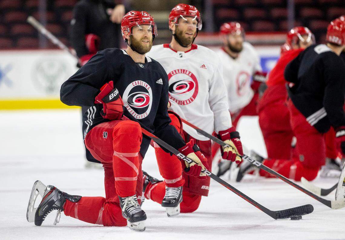 The Carolina Hurricanes Jaccob Slavin (74) and Jordan Staal (11) take turns shooting from the kneeling position during practice on Monday, May 15, 2023 at PNC Arena in Raleigh, N.C.