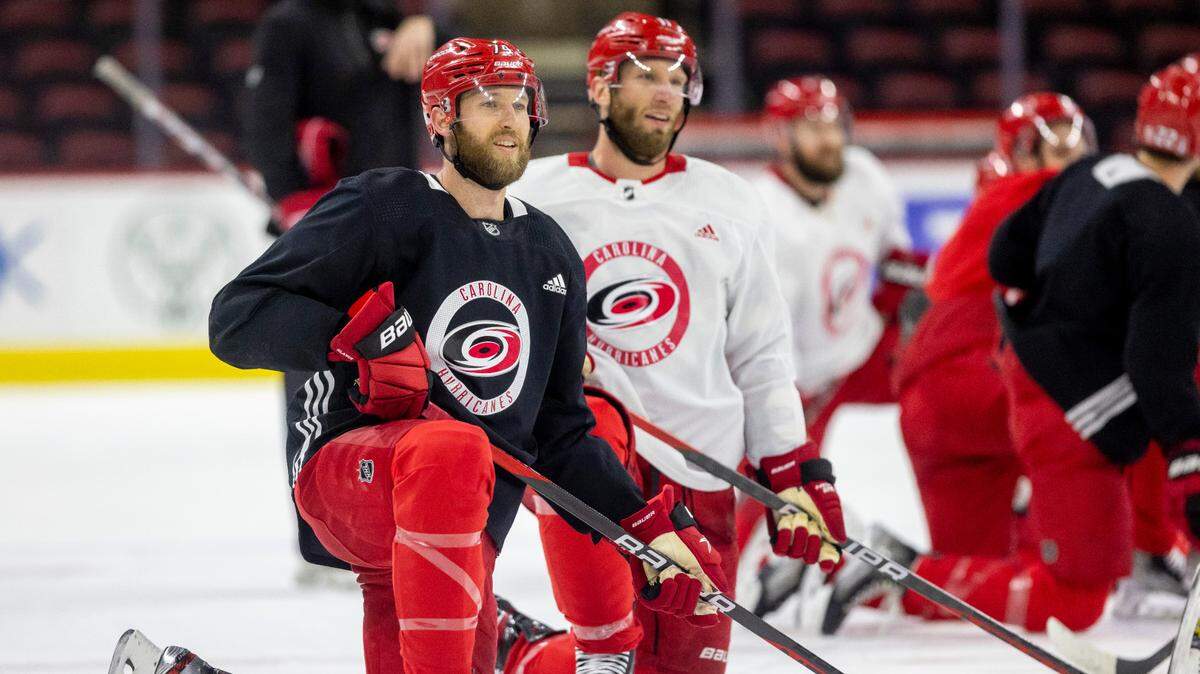 The Carolina Hurricanes Jaccob Slavin (74) and Jordan Staal (11) take turns shooting from the kneeling position during practice on Monday, May 15, 2023 at PNC Arena in Raleigh, N.C.