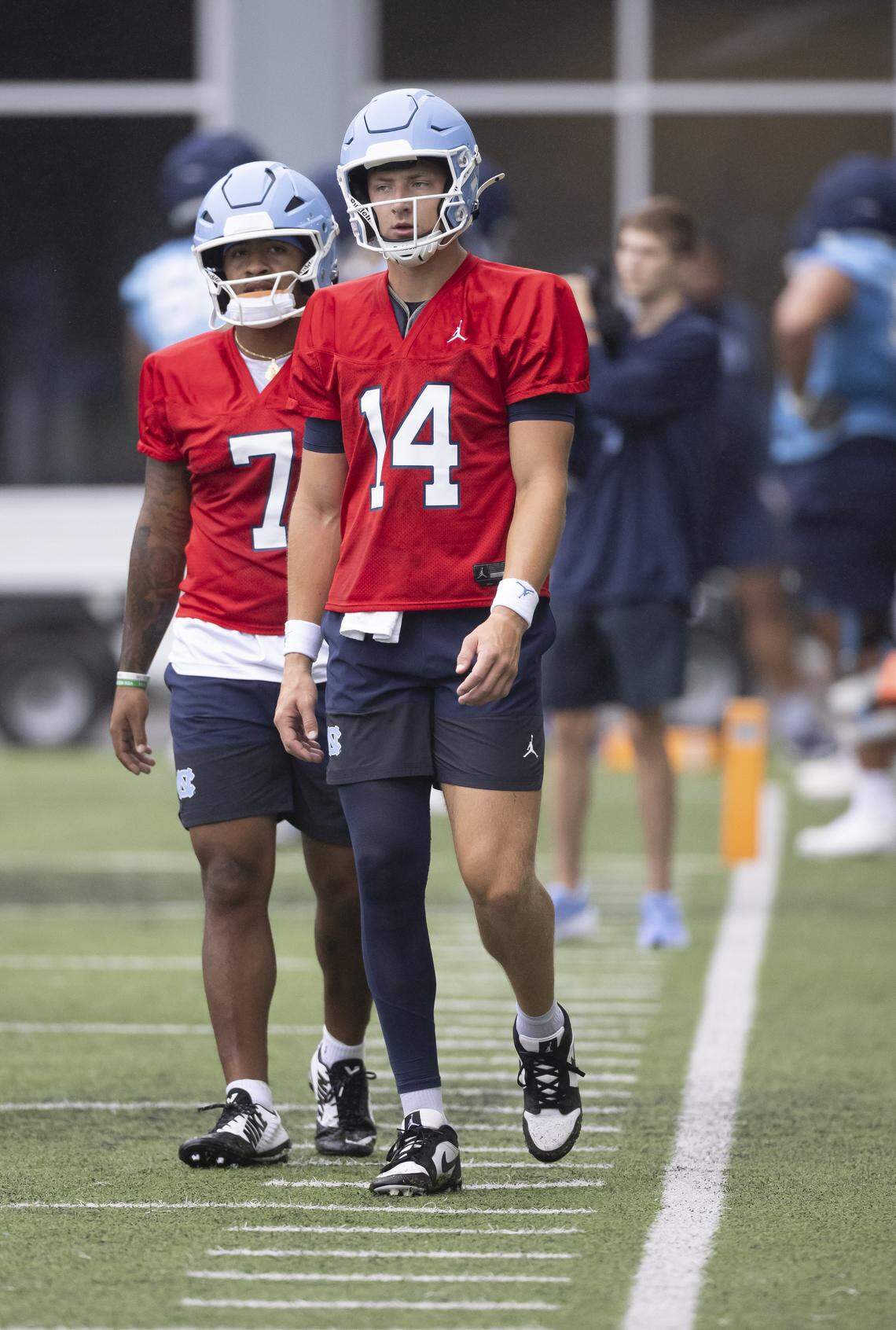 North Carolina quarterbacks Max Johnson (14) and Gio Lopez (7) who are competing for the starting position, move to the next drill during the Tar Heels’ practice on Saturday, August 2, 2025 in Chapel Hill, N.C.