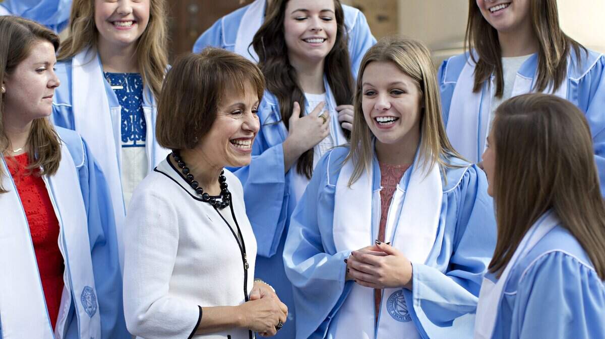 From left, UNC students Catherine Keller, Anna Moise, Kelly MacDevette, Maria Masciello, Katherine Hill and Katherine Koller speak to chancellor Carol Folt after asking her to join them in an impromptu senior photo on UNC’s campus Thursday, May 7, 2015 in Chapel Hill, N.C.